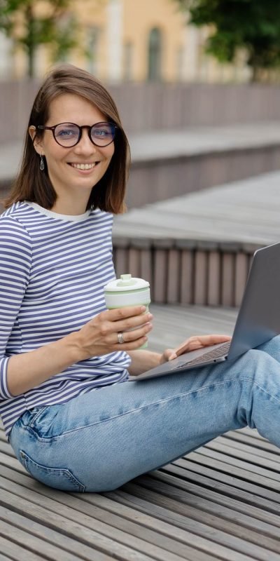 marketing-or-design-professional-working-and-drinking-coffee-outdoors.jpg